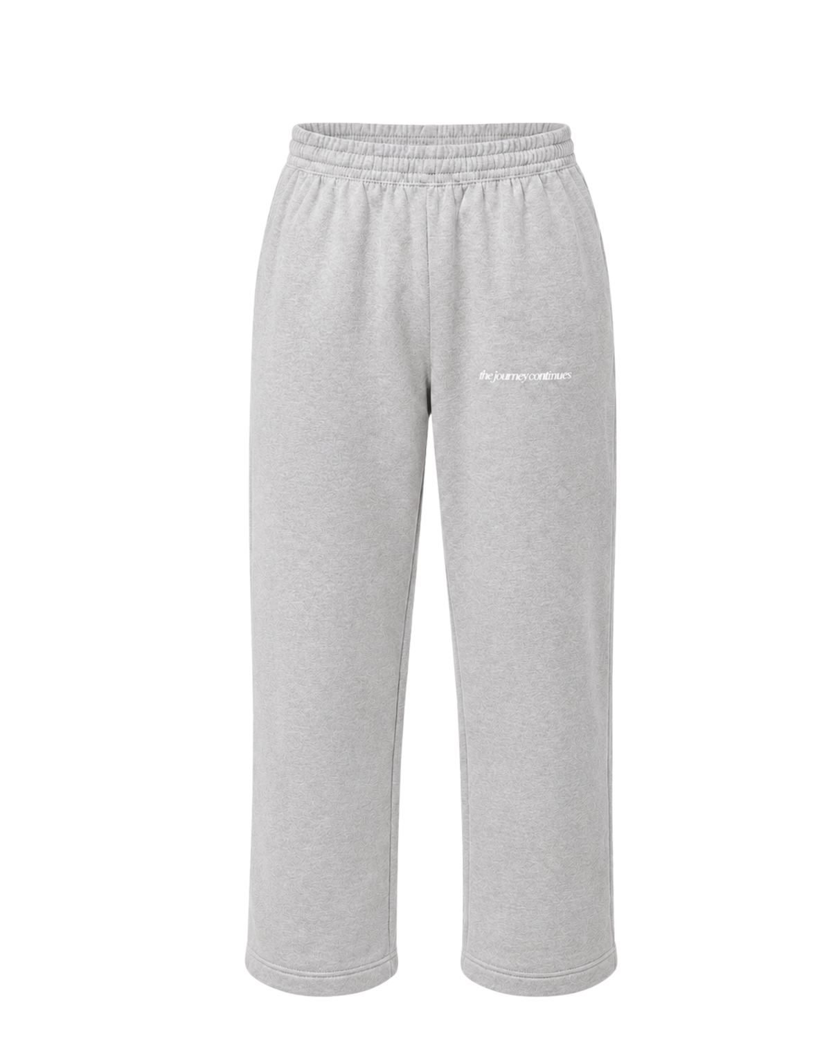 Front view grey regular sweatpants with subtle white "the journey continues" print on the front.