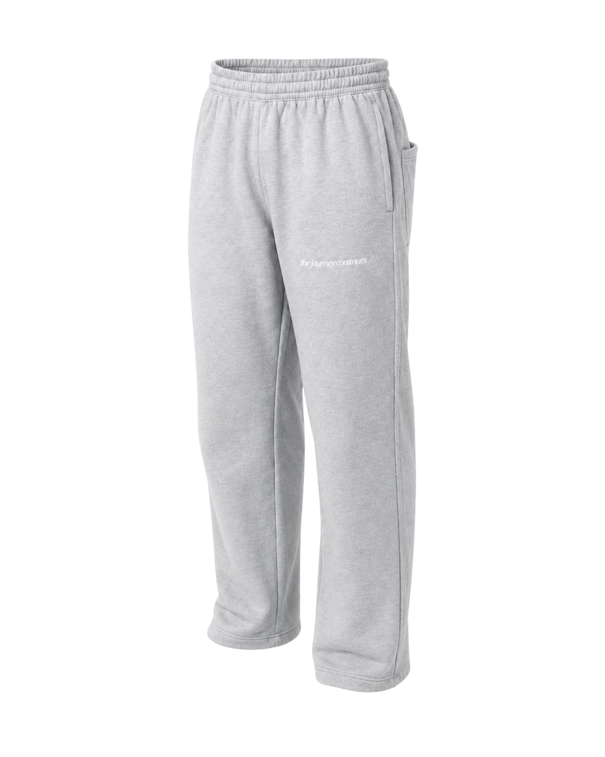 Front left view grey melange regular sweatpants with subtle white "the journey continues" print on the front.