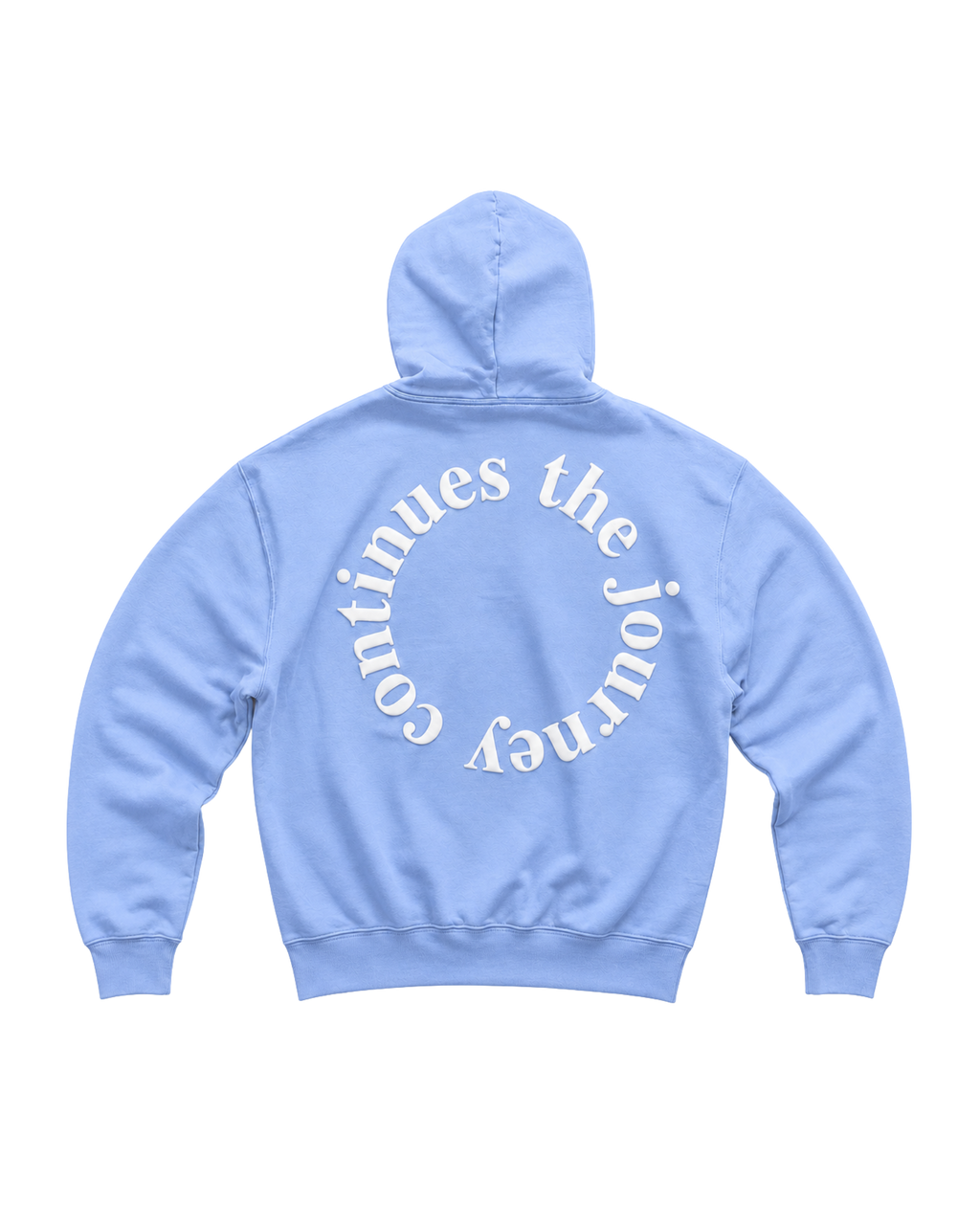 A light blue hoodie shown from the back, featuring a large white circular text graphic that reads 'the journey continues ' across the back.